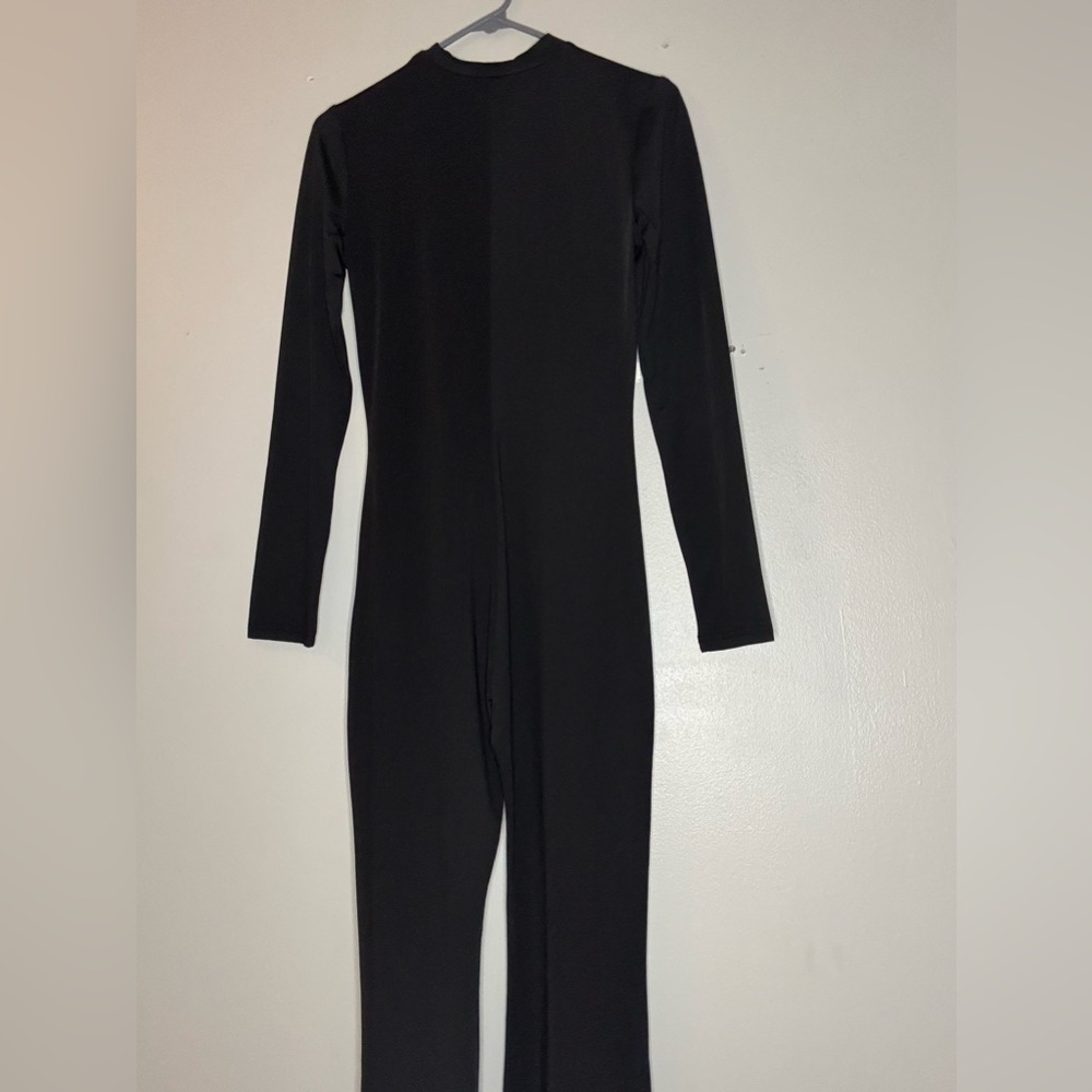 Women’s black bodycon jumpsuit.